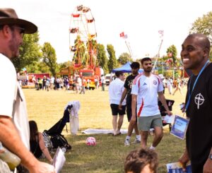 two men laughing at a festival